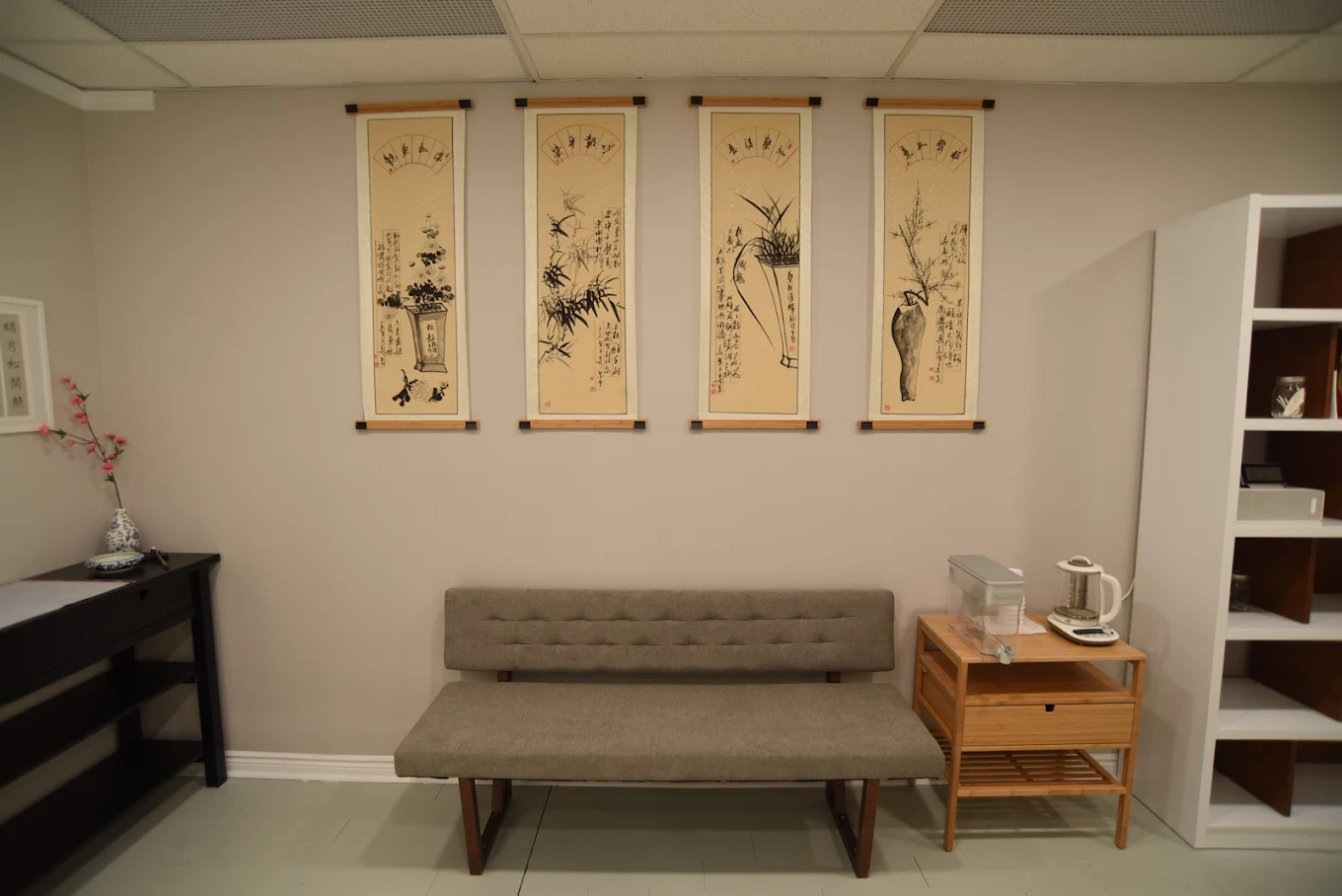 Qi TCM Clinic Waiting Room with Traditional Chinese Artwork